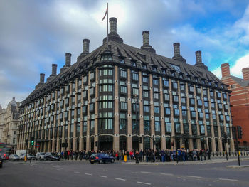 View of buildings against cloudy sky