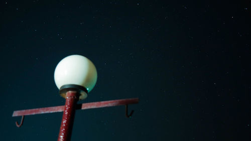 Low angle view of street light against sky at night