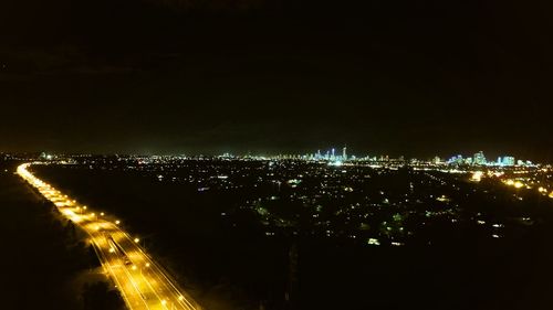 Illuminated cityscape at night