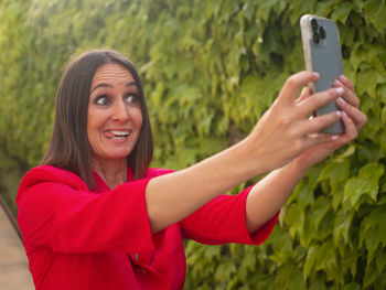 Mature woman taking a funny selfie