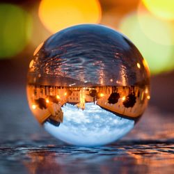 Close-up of illuminated crystal ball in water