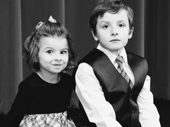 Portrait of friends sitting in classroom during christmas