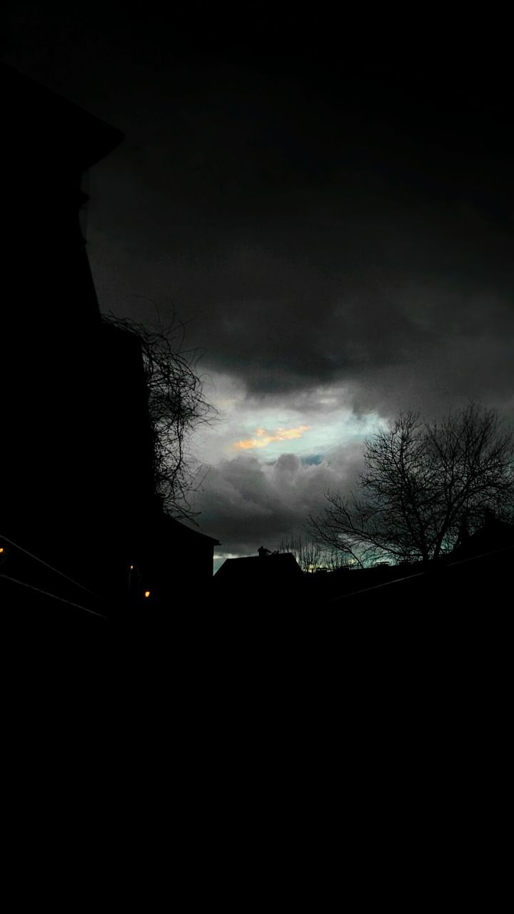 silhouette, sky, cloud - sky, dark, tree, rain, no people, wet, land vehicle, outdoors, nature, thunderstorm, night, close-up