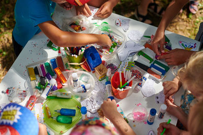 High angle view of boy playing with toys