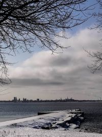 Scenic view of sea against cloudy sky