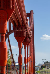 Low angle view of red building against clear blue sky