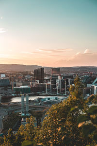 High angle view of buildings against sky during sunset