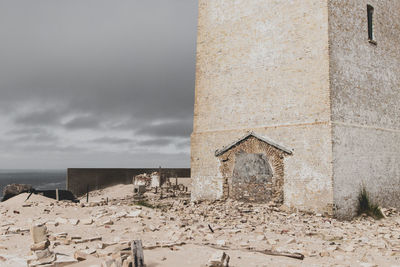 Old abandoned building against sky