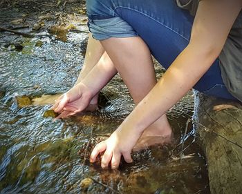 Low section of person in lake