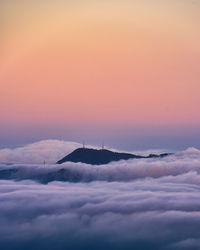 The mountain of rocacorba surrounded by clouds at sunset