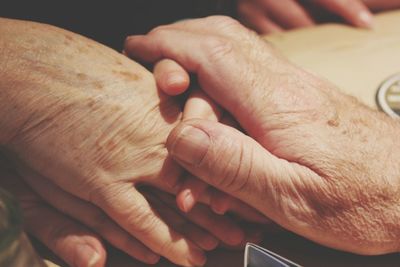 Close-up of consoling hands