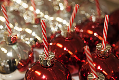 Red and silver colored christmas balls with candy canes