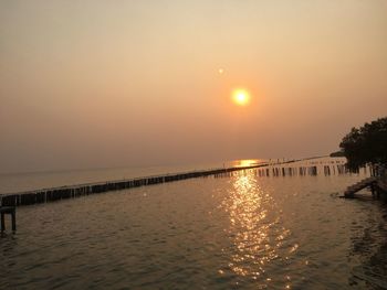 Scenic view of sea against clear sky during sunset