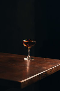 Close-up of wineglass on table