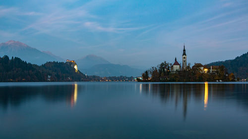 View of lake at temple against sky