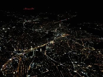 High angle view of illuminated cityscape at night