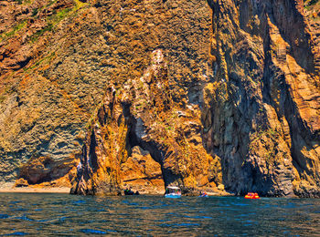 Scenic view of rocks by sea