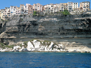 View of buildings by sea