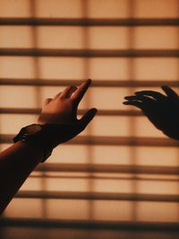 Close-up of hand on shadow