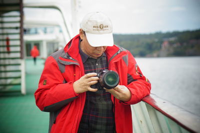 Portrait of man photographing