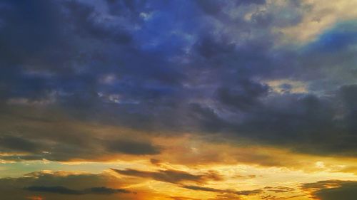 Low angle view of dramatic sky during sunset