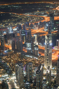 High angle view of illuminated city buildings at night