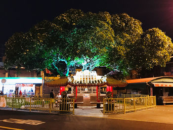 Illuminated buildings in city at night