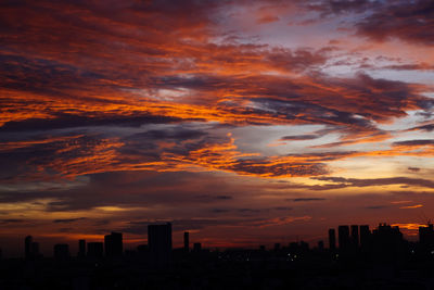 Silhouette landscape against scenic sky