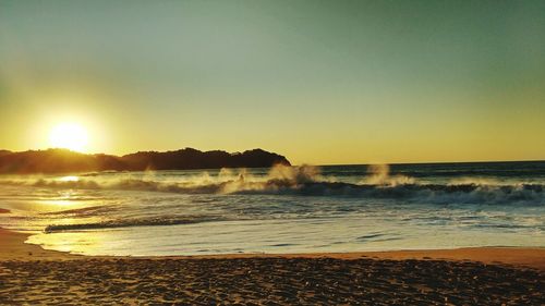 Scenic view of sea at sunset