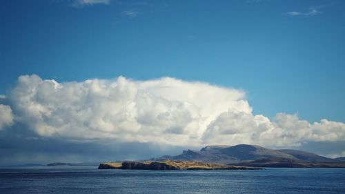 Scenic view of sea against cloudy sky