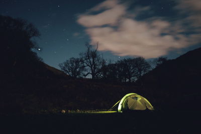 Scenic view of landscape against sky at night