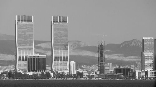 Modern buildings in city against sky