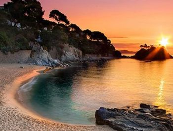 View of beach at sunset