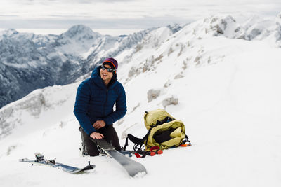 People skiing on snowcapped mountain