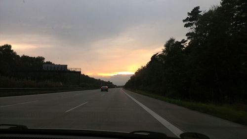 Road seen through car windshield