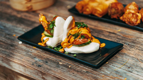 Close-up of serving food in plate on table