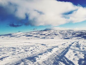 Scenic view of snow covered mountains