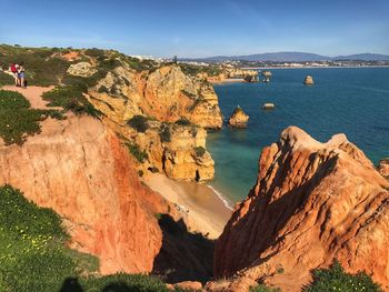 Panoramic view of sea and mountains against sky