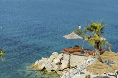 High angle view of rocks by sea