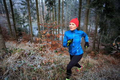 Woman jogging in forest