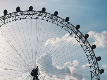 Low angle view of ferris wheel against sky