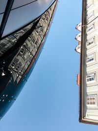 Low angle view of buildings against blue sky