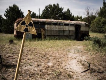 Abandoned vehicle on field