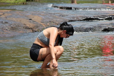 Side view of man in lake