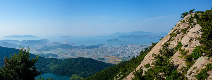 Scenic view of mountains against blue sky