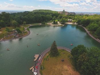 High angle view of river and trees in city