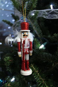 Close-up of christmas decorations hanging on tree