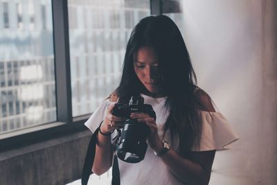Beautiful young woman looking away