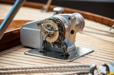 The anchor winch of a hand made wooden boat. 
