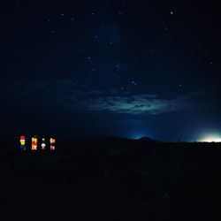 Scenic view of silhouette mountain against sky at night